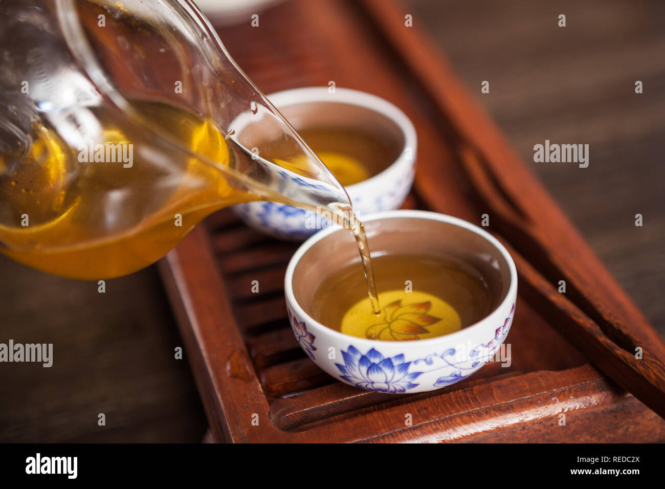 Cropped shot of pouring tea in traditional chinese teaware. Stock Photo