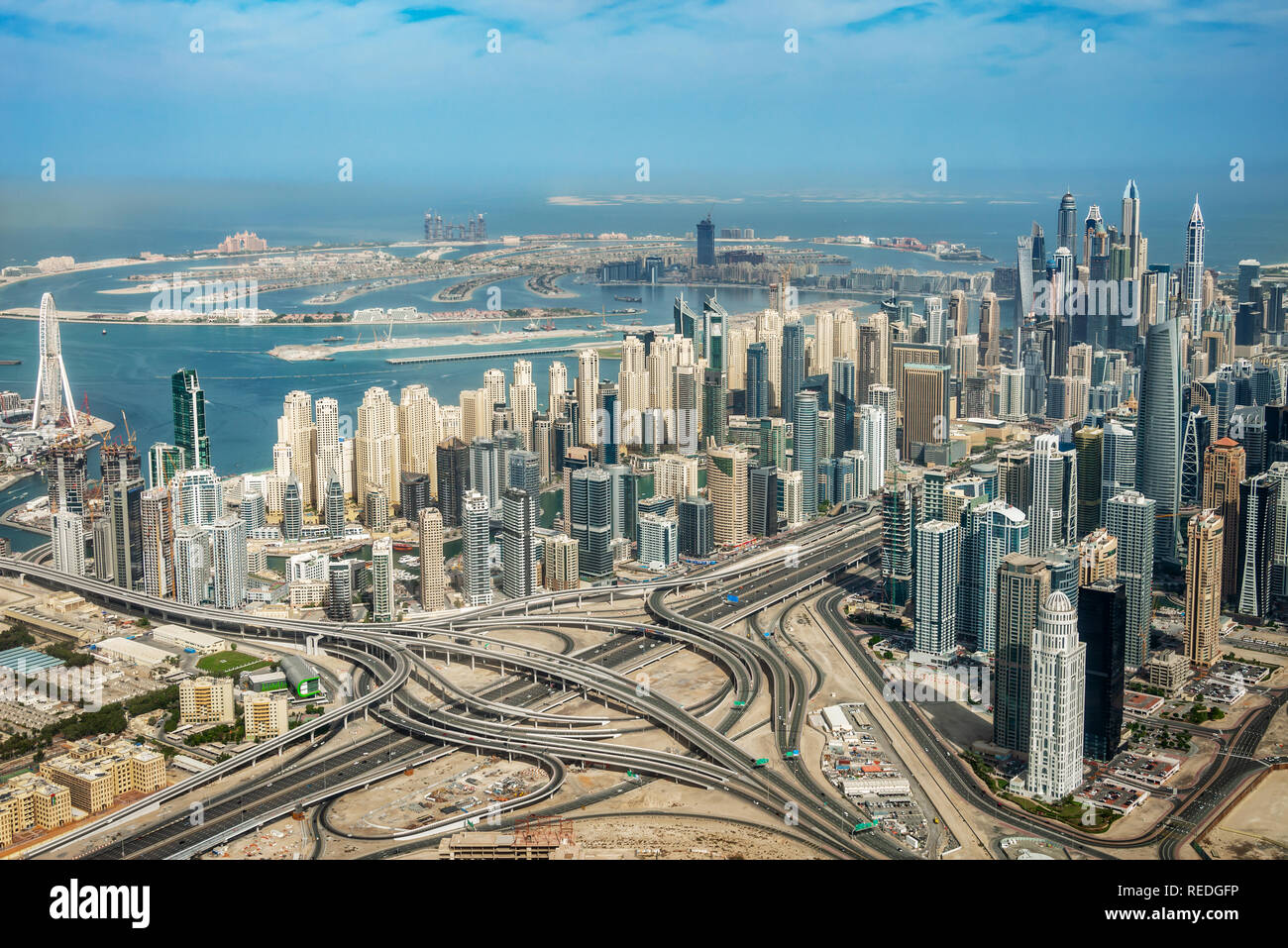 Aerial view of Dubai Marina skyline, road interchange and Palm Jumeirah, United Arab Emirates Stock Photo
