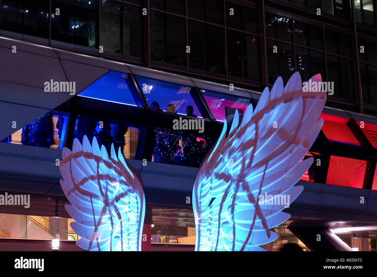 London, England – January 2019 : Colour Moves -  Adams Plaza Bridge,  Winter Lights Festival 2019. Interactive art installations at Canary Wharf Stock Photo