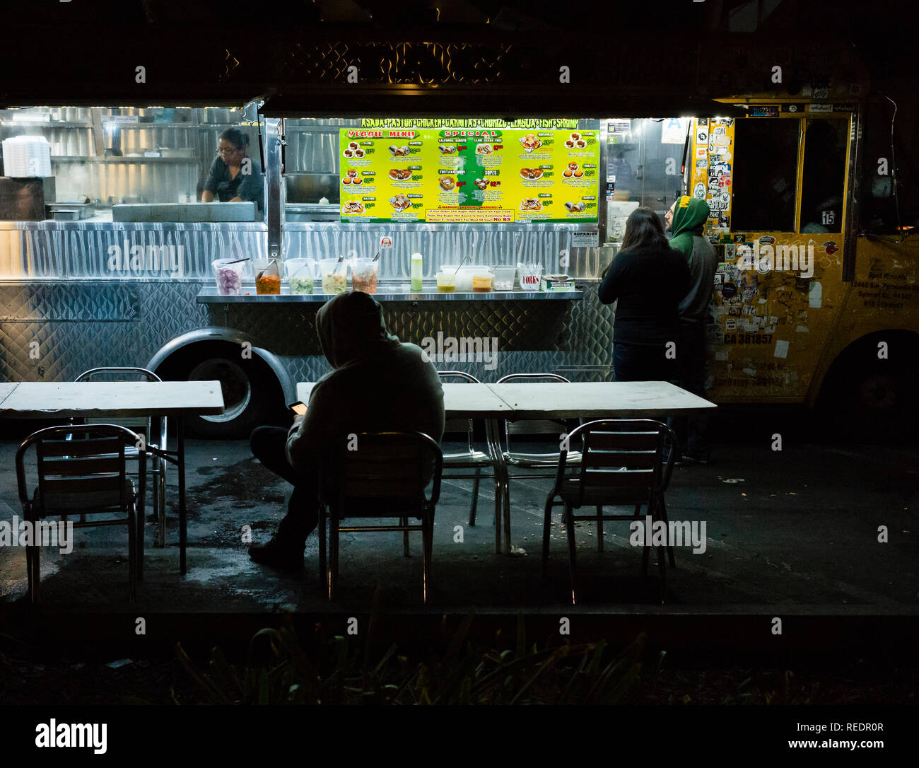 Late-night food truck serving burgers, tacos, and poutines