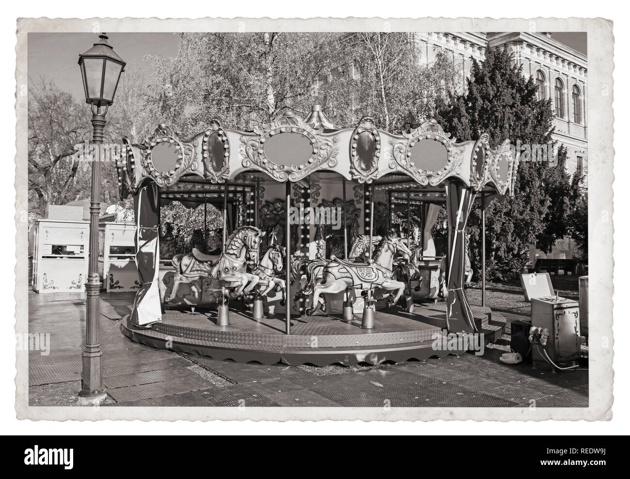 Old fashioned french carousel with horses Vintage Monochrome photo Stock Photo