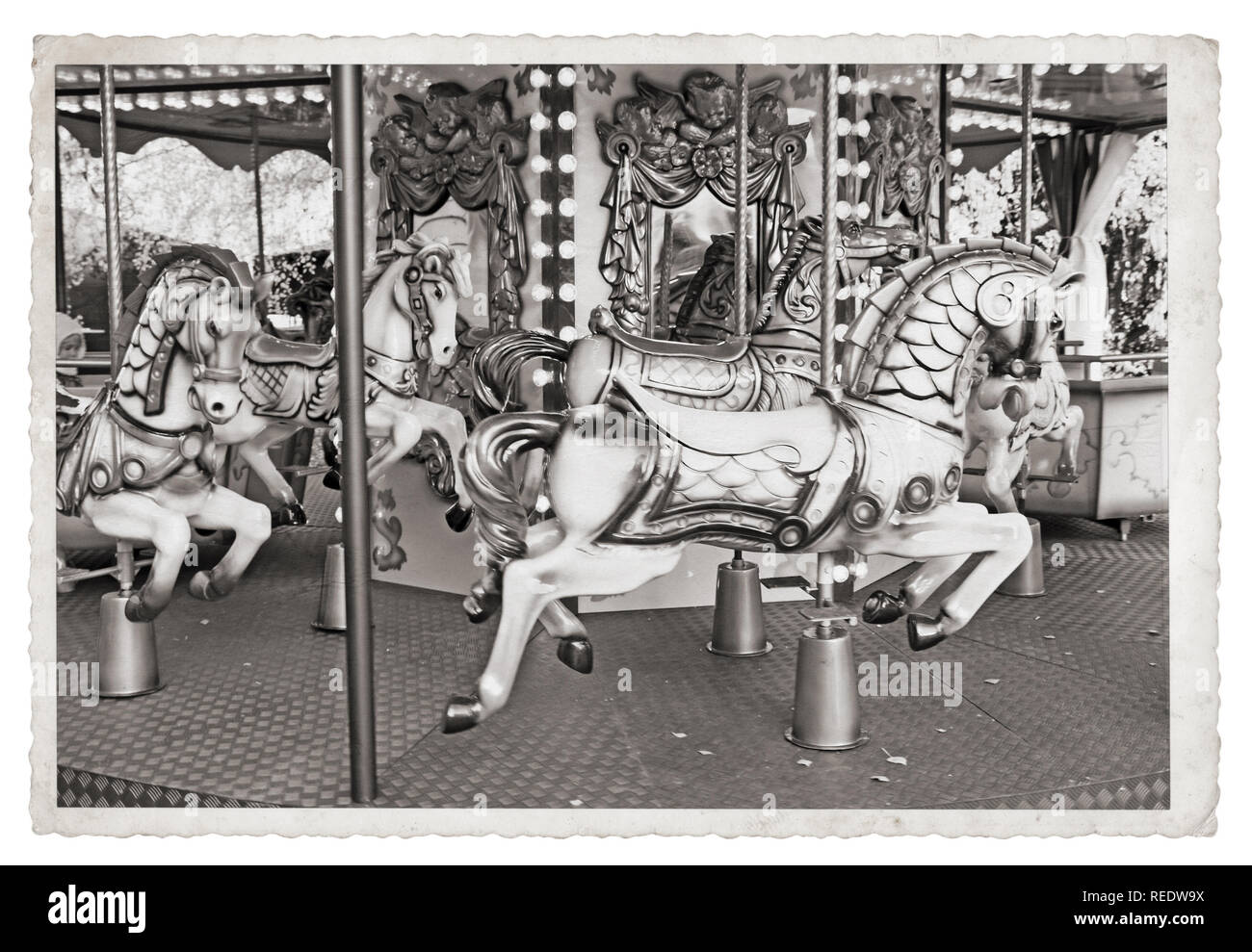 Old fashioned french carousel with horses Vintage Monochrome photo Stock Photo