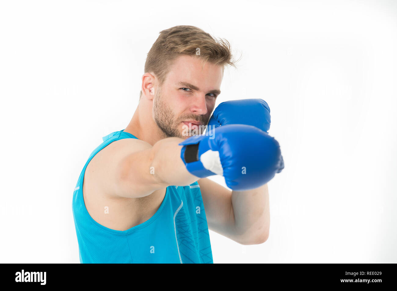 Sportsman boxer concentrated training boxing gloves. Man concentrated face in blue gloves