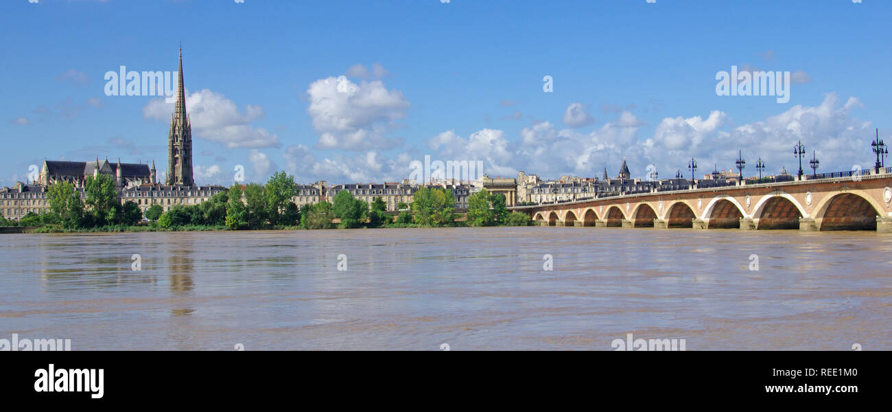 Large view on Bordeaux town with Garonne river in the foreground and also “Le Pont de Pierre”. Famous stone bridge Stock Photo