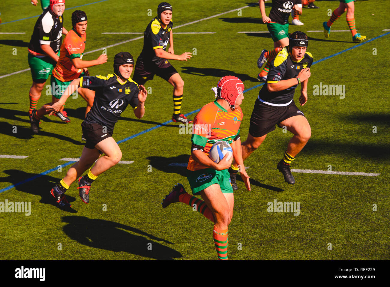 Valencia, Spain - January 19, 2019: Fight for the ball between players during an amateur rugby match. Stock Photo