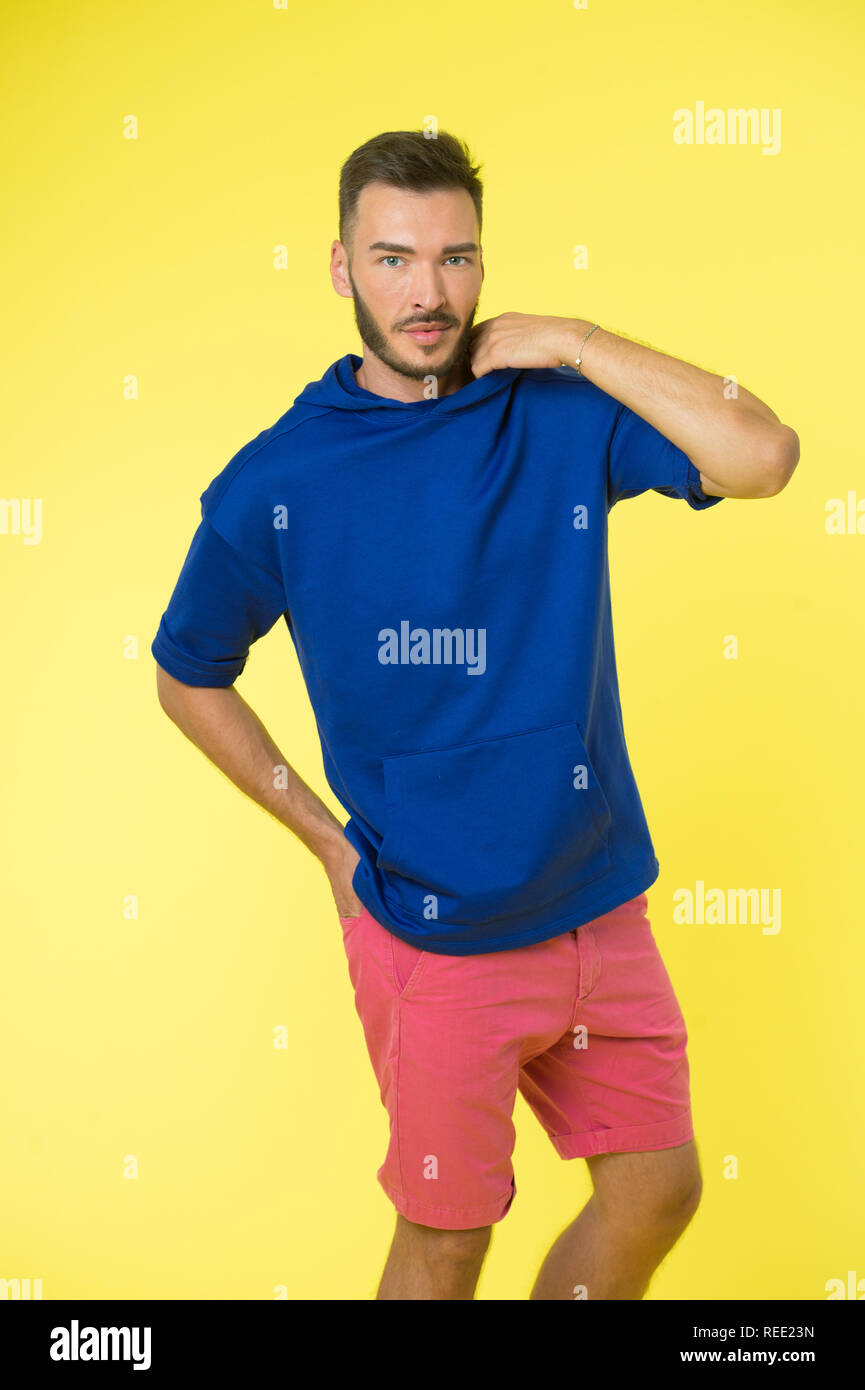 Active concept. Active lifestyle. Man in active wear on yellow ...