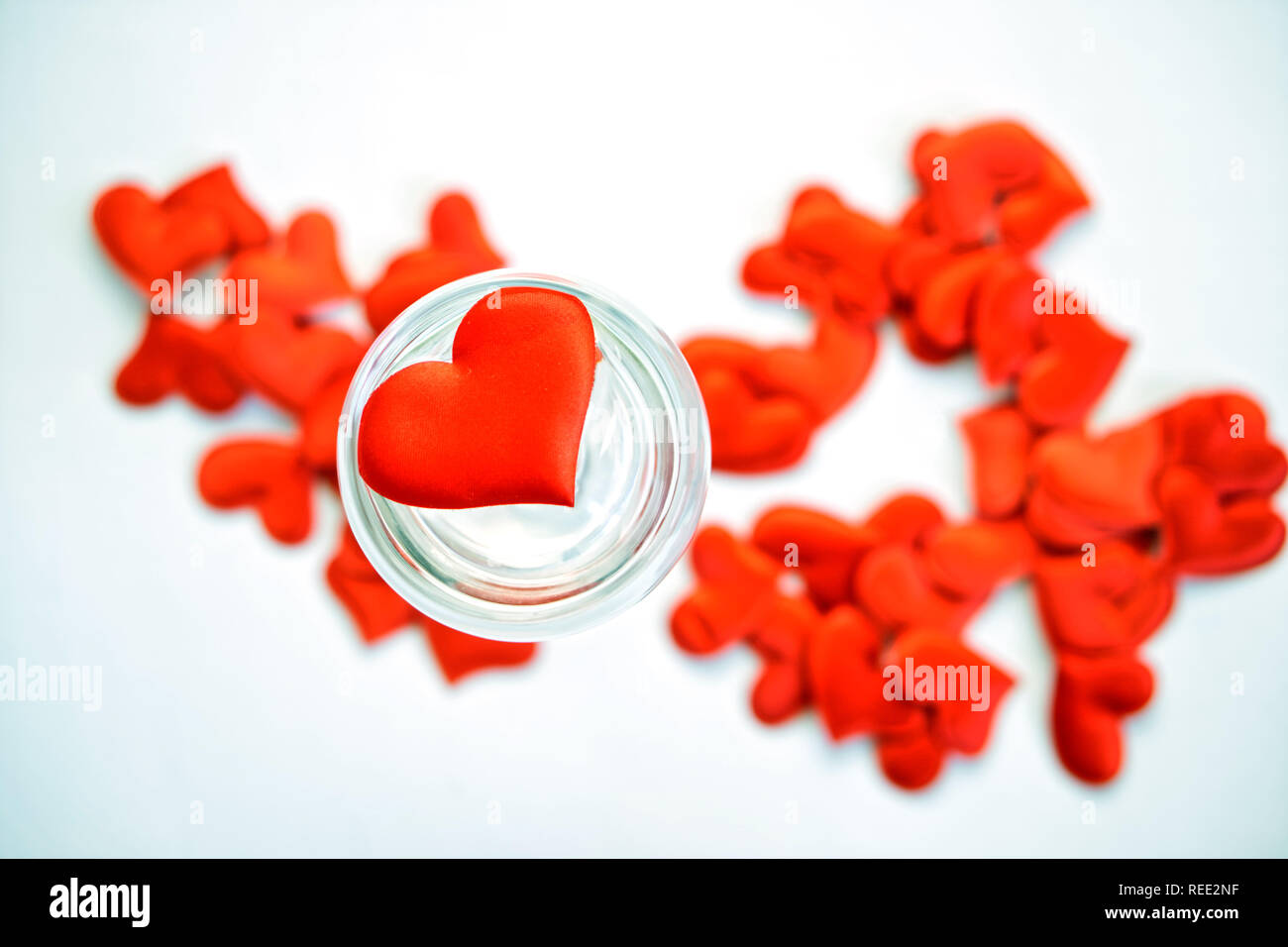Red heart in a transparent glass. St. Valentine's Day. Congratulations on Valentine's Day. Stock Photo