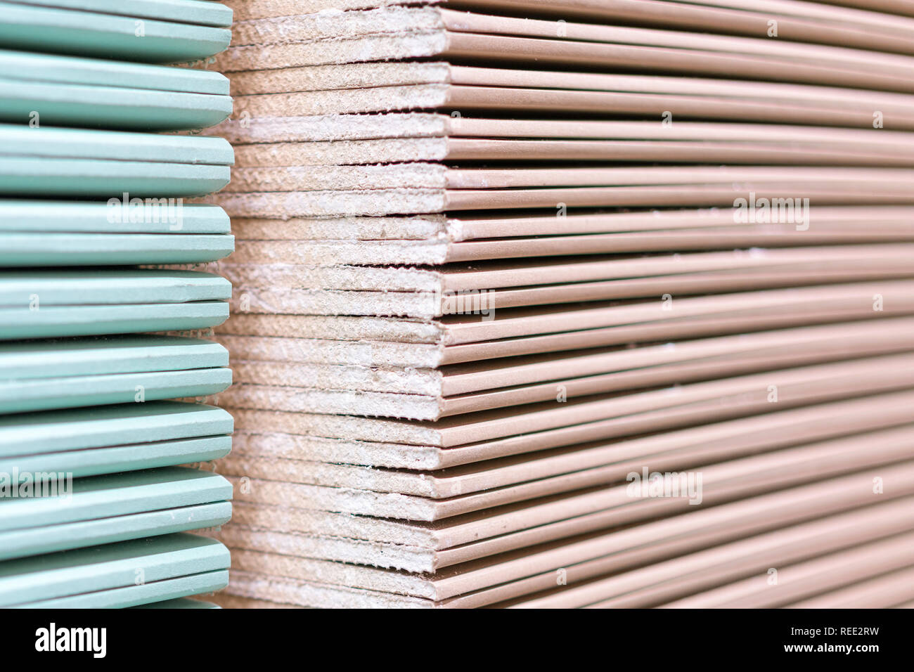 Gypsum plasterboard in the pack. The stack of gypsum board preparing