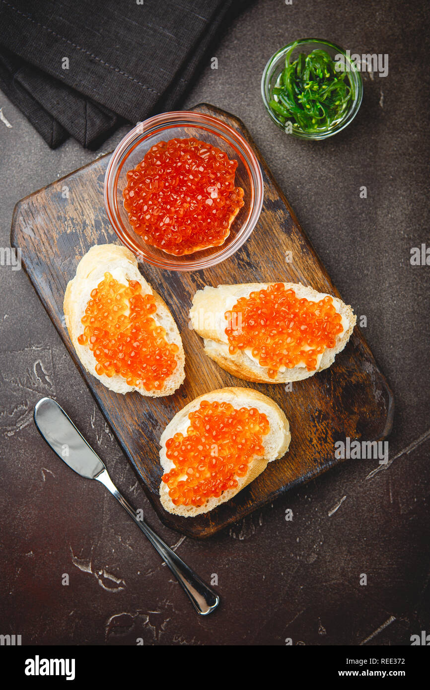 Red Toasts Delicious toasts with red caviar on the holiday table Stock Photo - Alamy
