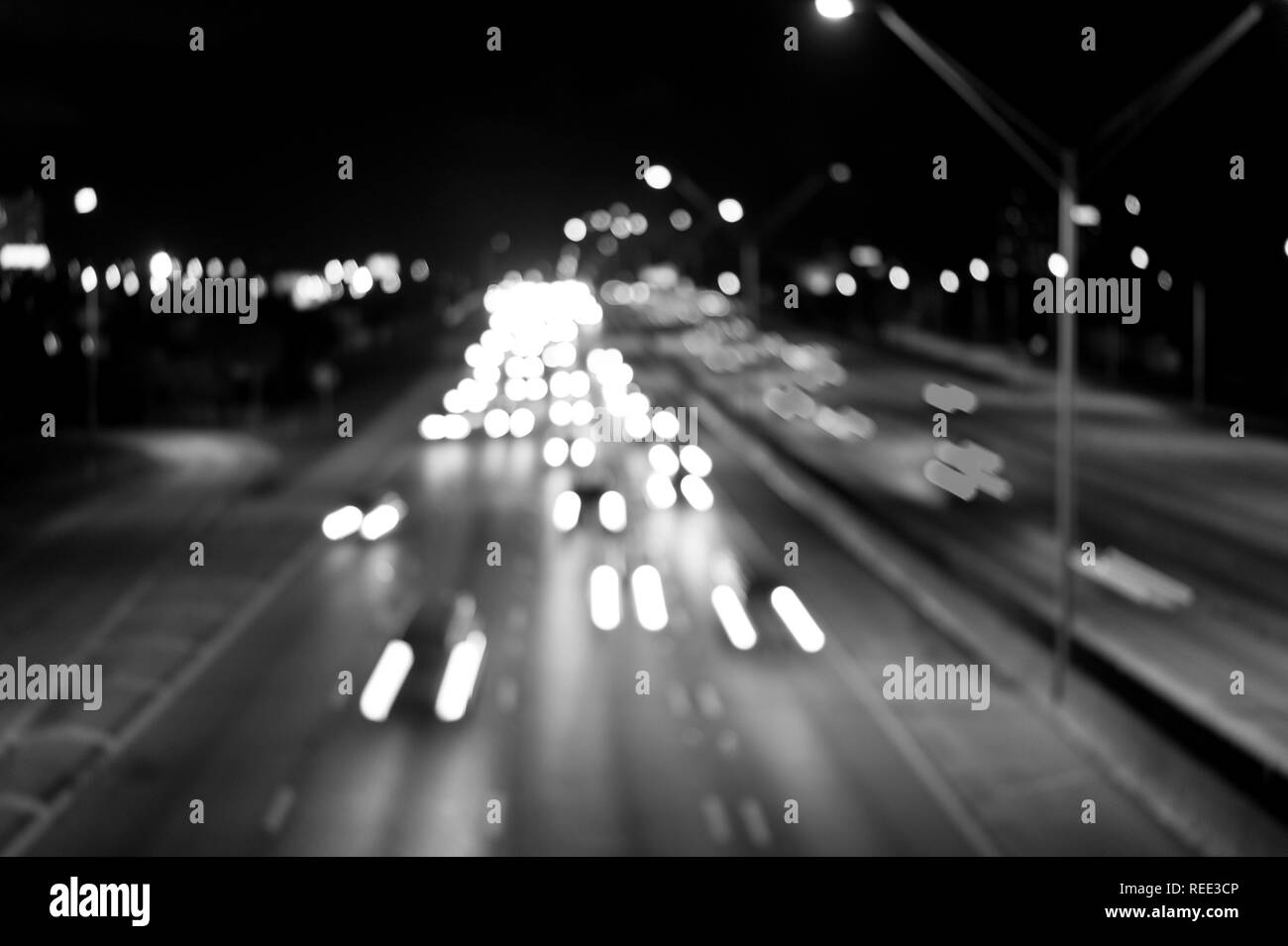 Traffic, speed, motion concept. Highway road with car trails at night on dark sky background. Transport, transportation, travel, trip Stock Photo