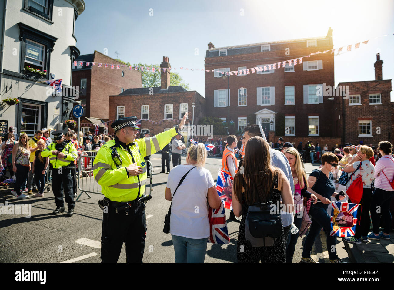 WINDSOR, UNITED KINGDOM - MAY 19, 2018: Met Police officers directing people traffic for royal wedding marriage celebration of Prince Harry, Duke of Sussex and the Duchess of Sussex Meghan Markle   Stock Photo