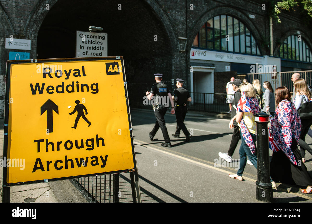 WINDSOR, BERKSHIRE, UNITED KINGDOM - MAY 19, 2018: Crowd walking near Royal Wedding road sign on the day of the royal wedding of Prince Harry and Meghan Markle  Stock Photo