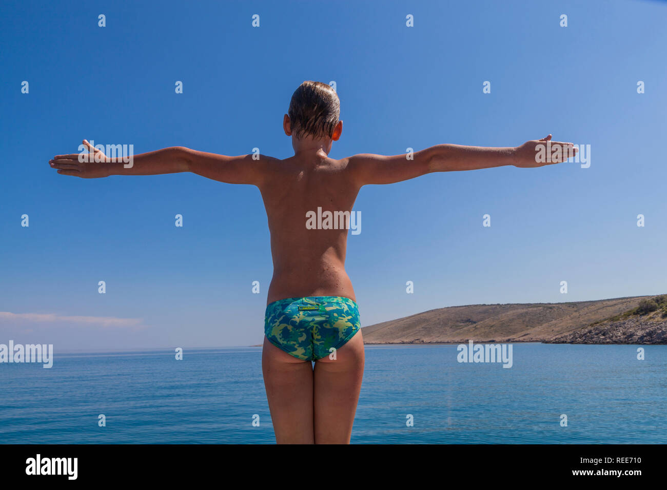 cute speedo boy A portrait of a cute boy on a boat Stock Photo - Alamy