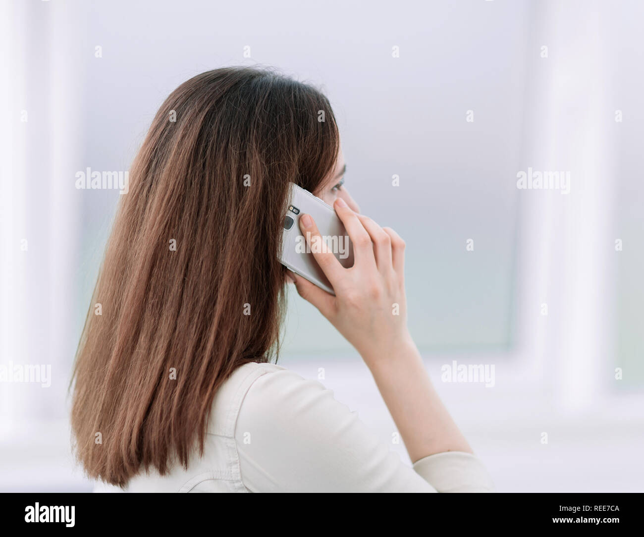 Woman talking one phone rear view hi-res stock photography and images ...