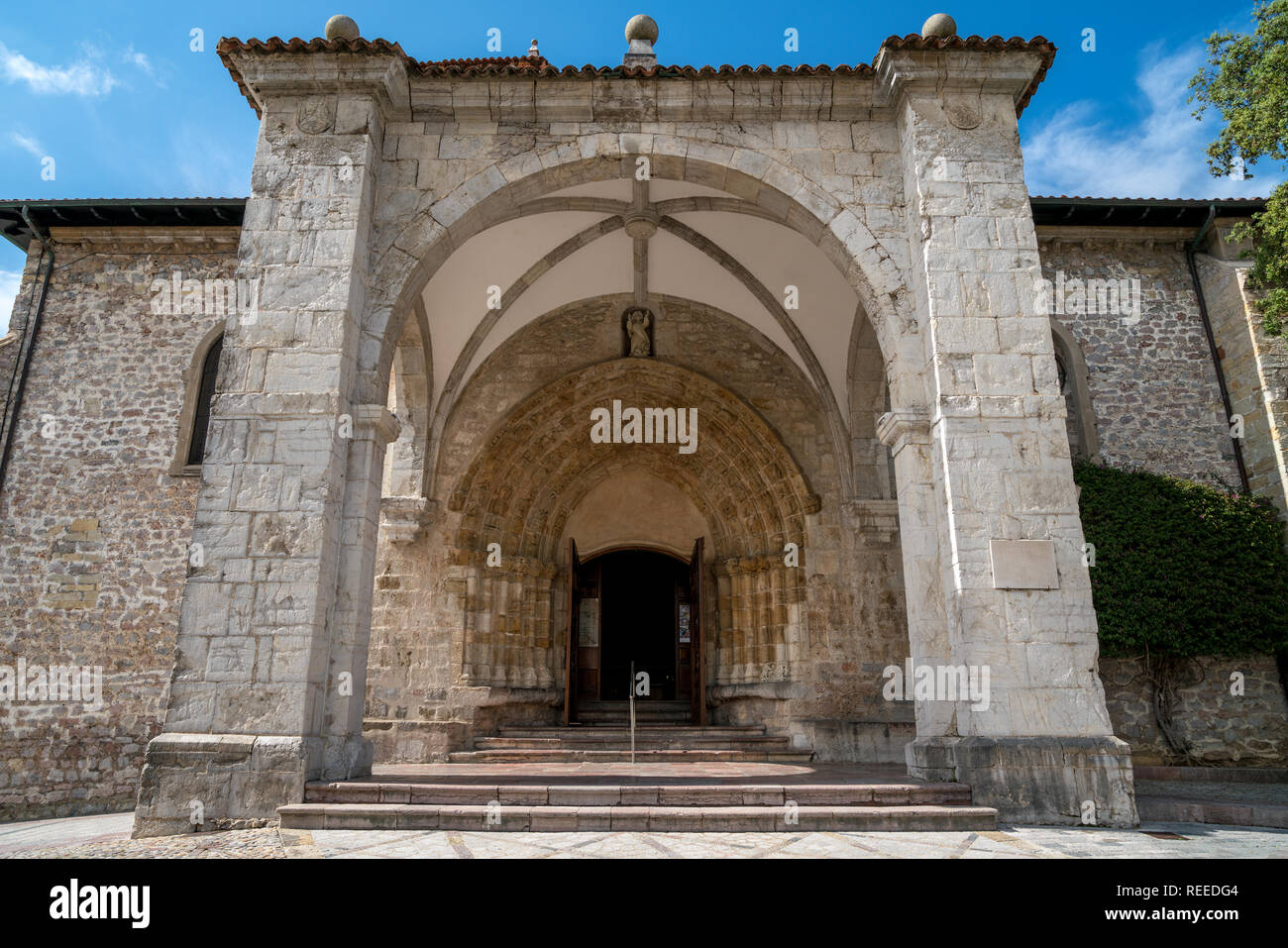 Southern portal of Iglesia de Santa María del Conceyu in Llanes, Asturias, Spain Stock Photo
