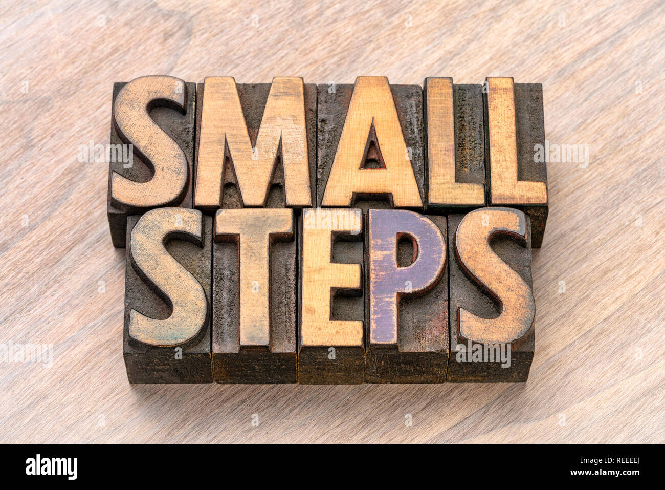small steps word abstract in vintage letterpress wood type printing blocks Stock Photo