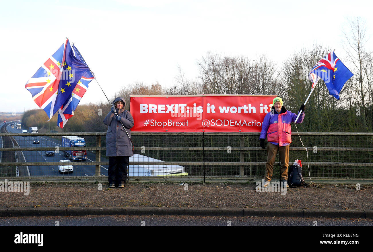 Louise Hummerstone and Hugh Riddle of the SODEMAction group campaign against Brexit on a motorway bridge above the M20 near Ashford in Kent. Stock Photo