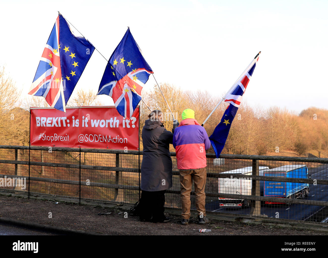 Louise Hummerstone and Hugh Riddle of the SODEMAction group campaign against Brexit on a motorway bridge above the M20 near Ashford in Kent. Stock Photo