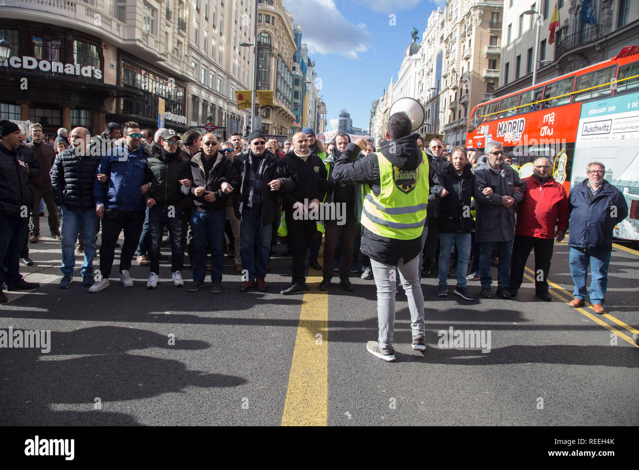 Taxi drivers seen marching along the Gran Vía during the strike. Hundreds of taxi drivers started an indefinite strike to pressure the Administrations in the regulation of transport vehicles with driver (VTC in Spanish). Stock Photo