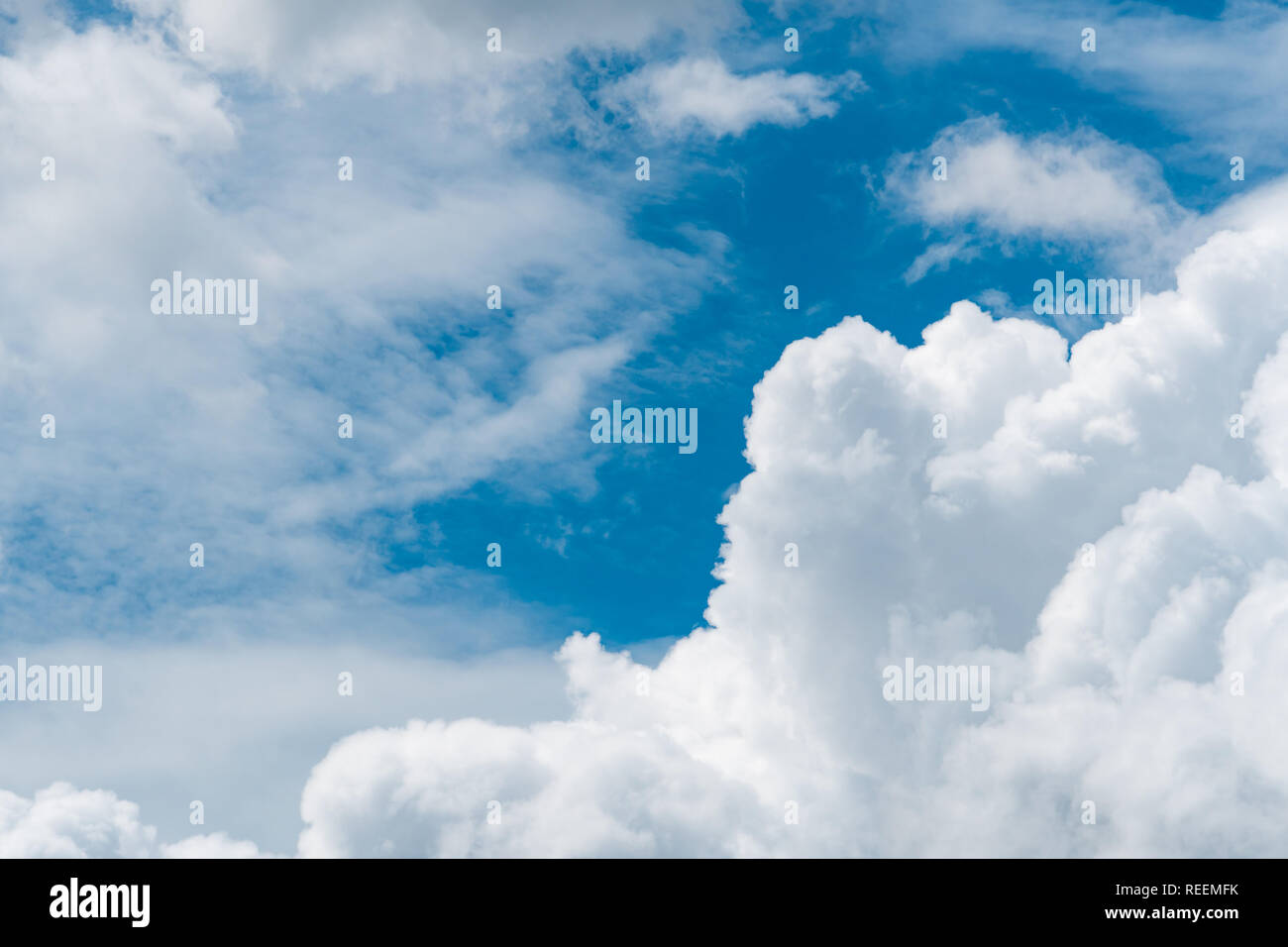 Blue sky and white cumulus clouds on sunny day. Fluffy white clouds and ...