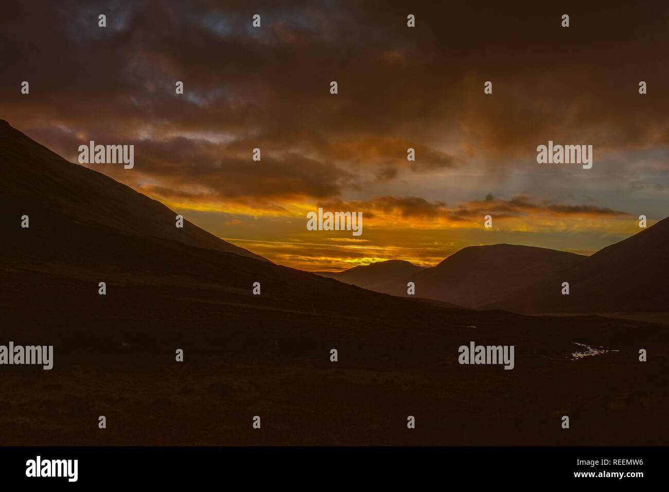 Sunset over Isle of Skye Hills Stock Photo