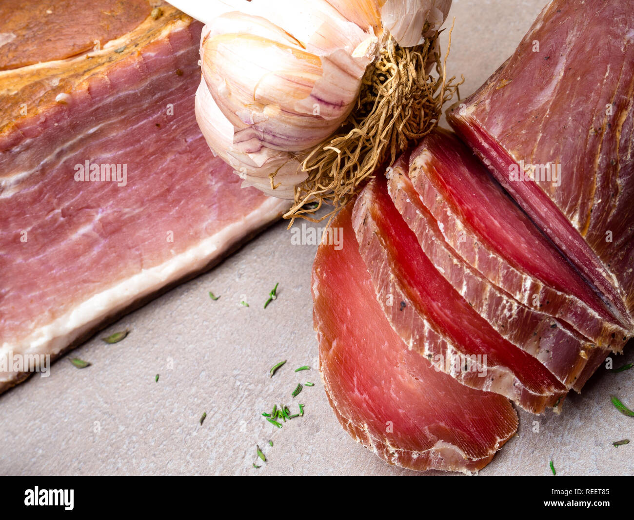 Smoked ham, jerky corned beef on table with garlic Natural product from
