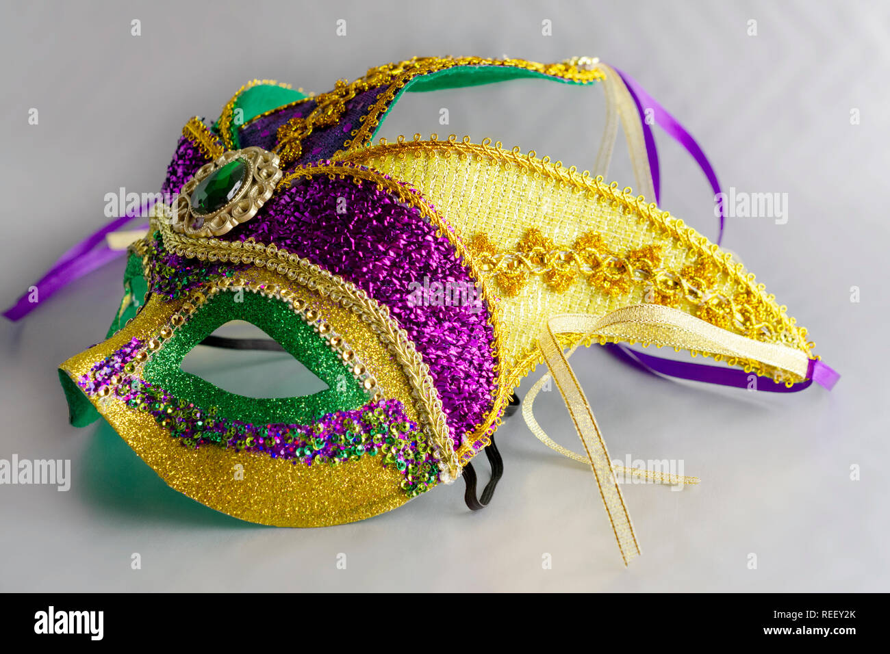Jester mask up close. Full mask. Cropped landscape. Grey background ...