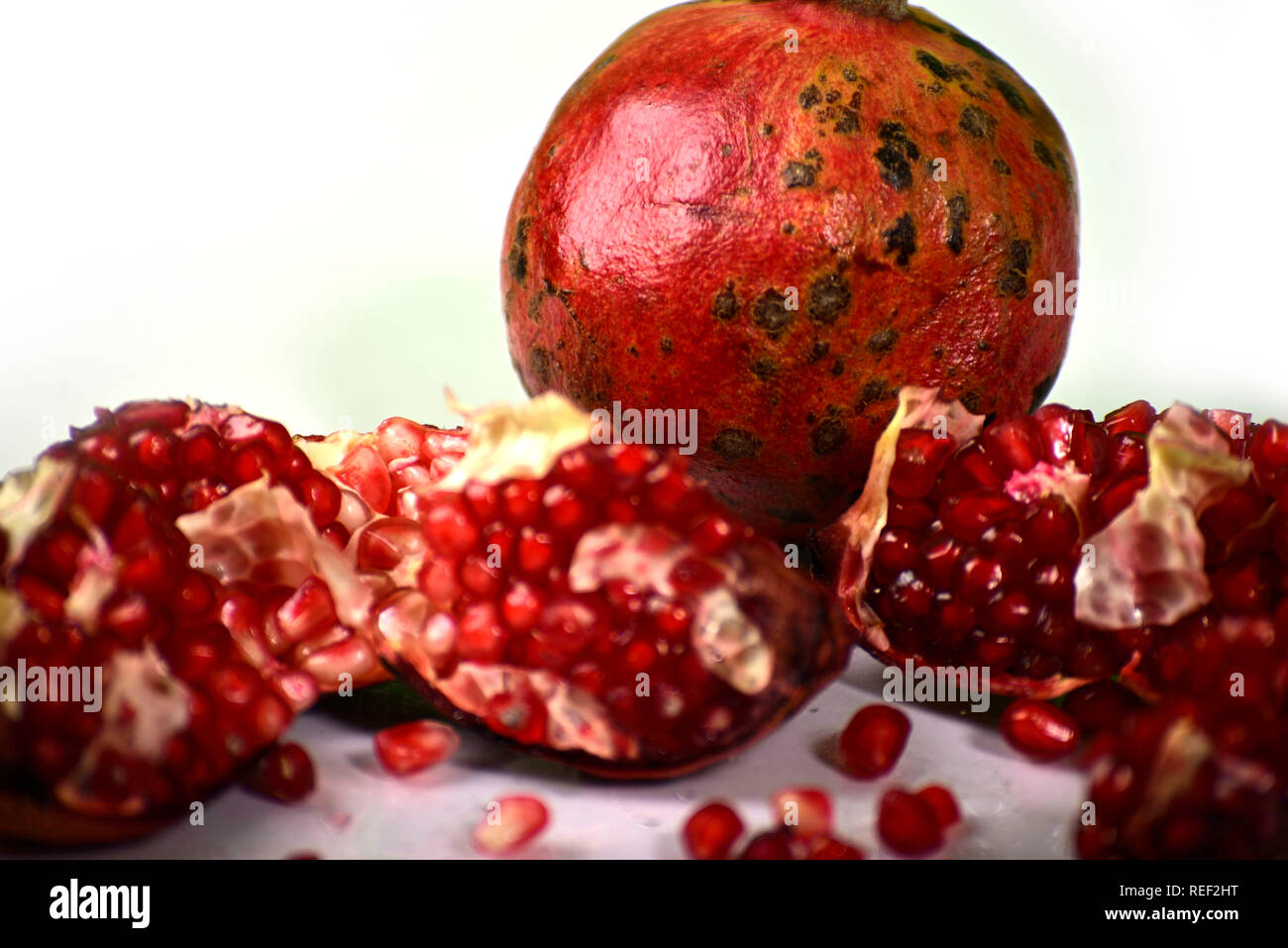 Juicy pomegranate on white background Stock Photo