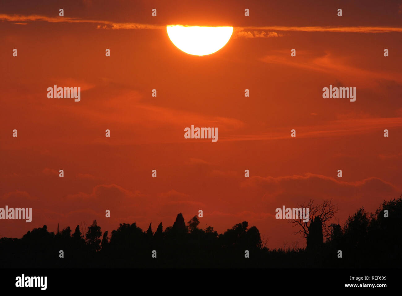Sunset Rays Isolated image of a sunset with the sun isolated Stock Photo - Alamy