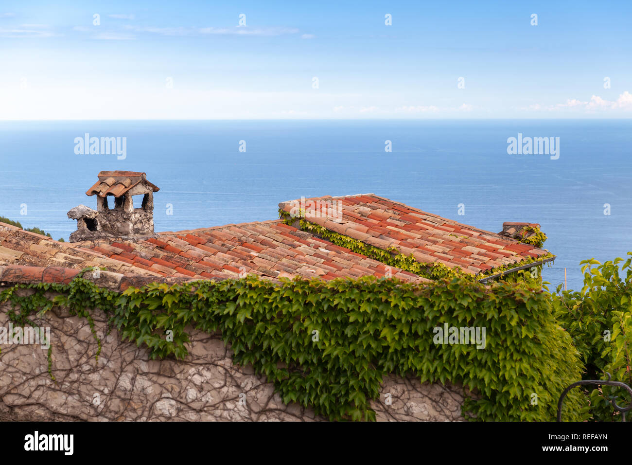 Eze village coastal view with old red tile roofs. Alpes-Maritimes, France Stock Photo