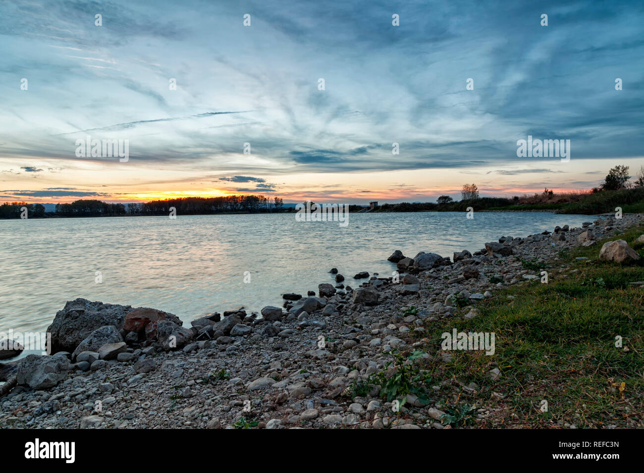 landscape in a lake at sunset Stock Photo - Alamy
