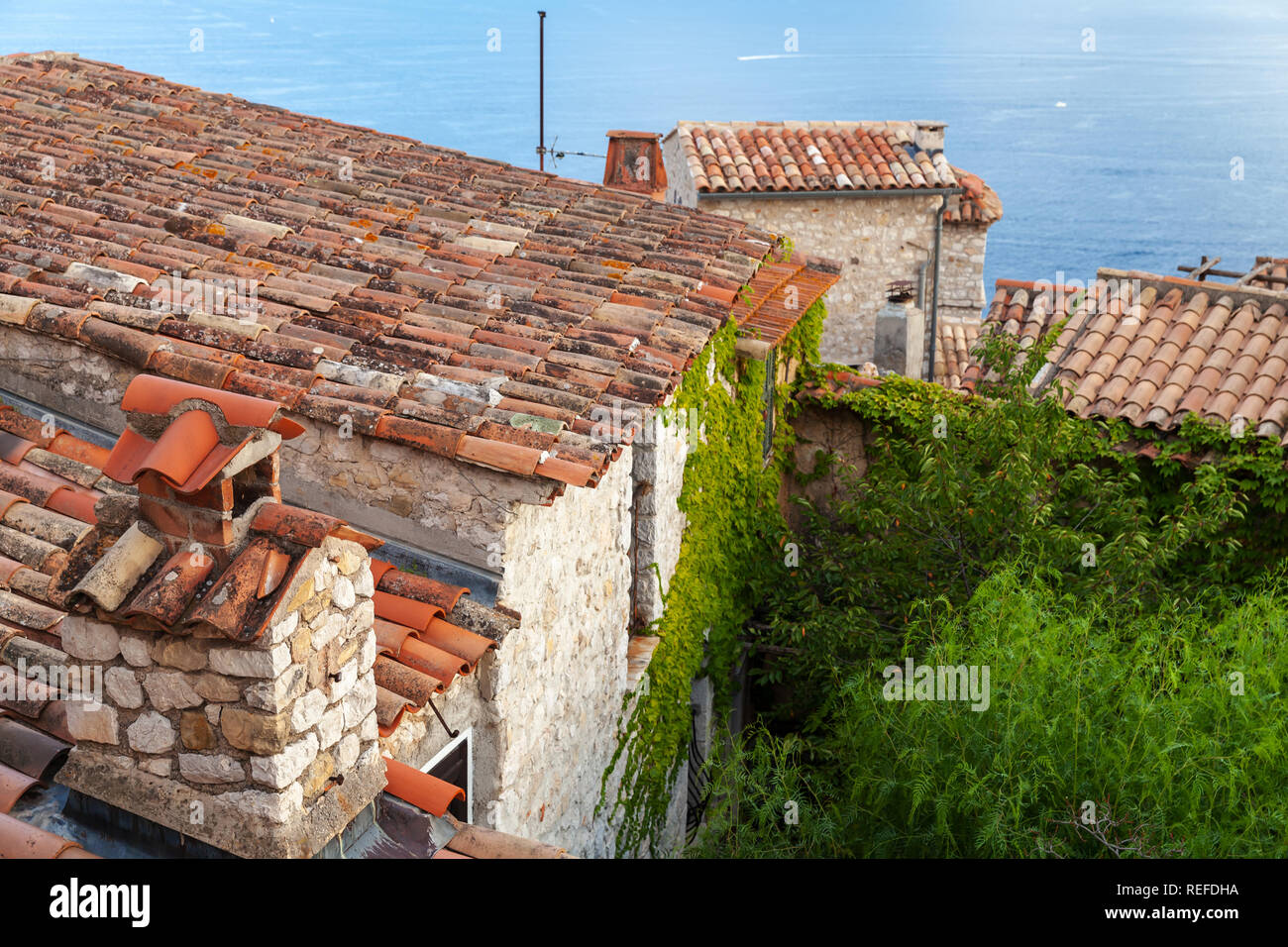 Eze village landscape with old red tile roofs. Alpes-Maritimes, France Stock Photo