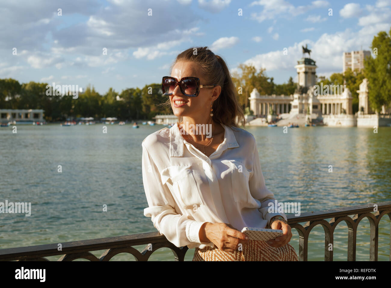 smiling elegant woman in white blouse 