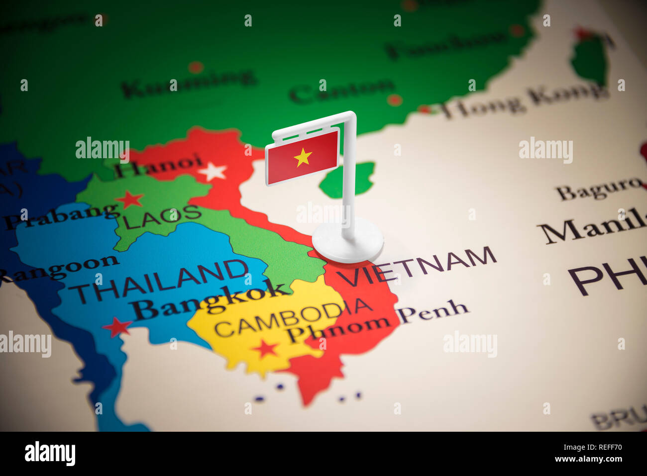 Vietnam marked with a flag on the map Stock Photo - Alamy