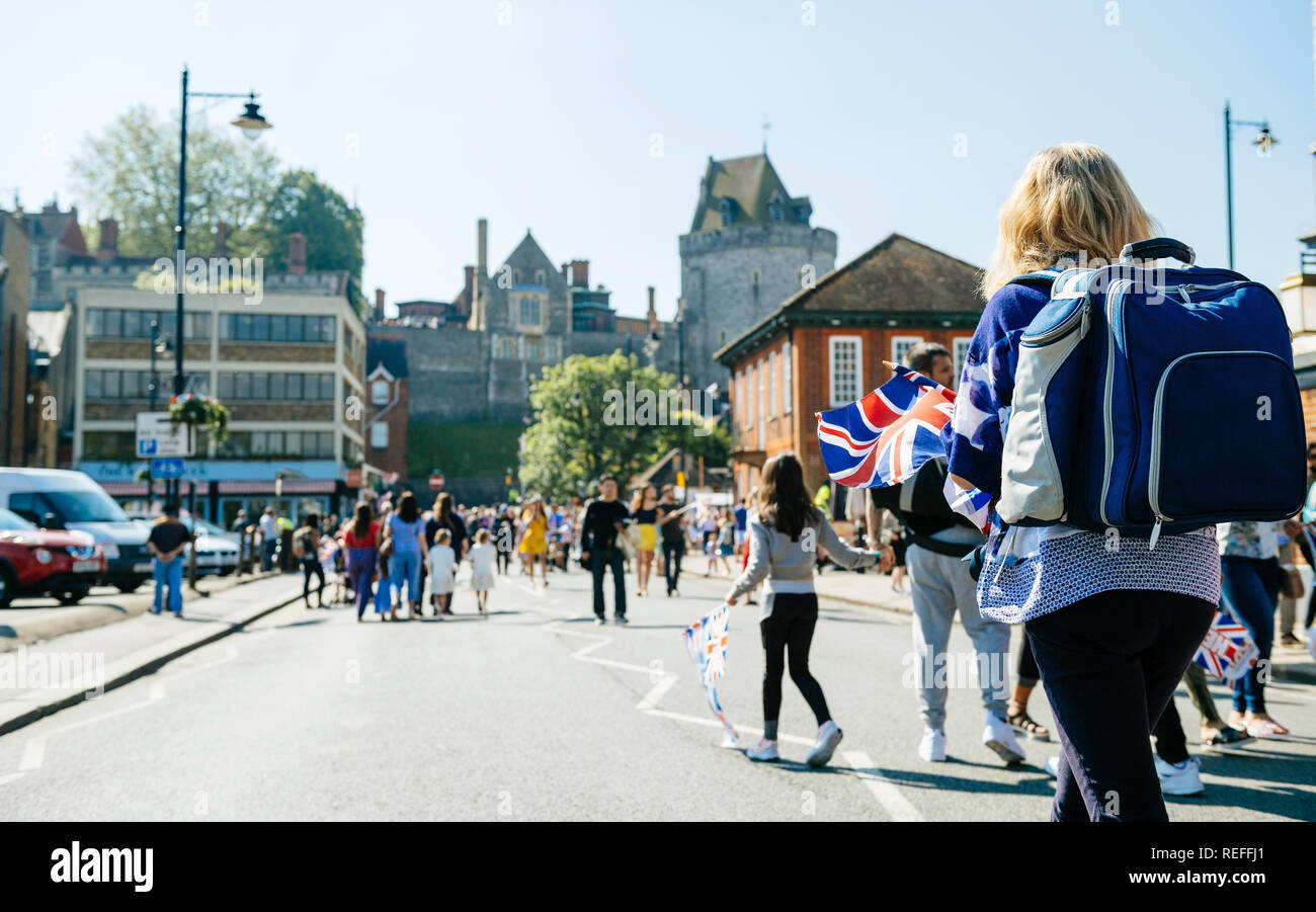Defocused view of people walking to royal wedding marriage celebration of Prince Harry, Duke of Sussex and the Duchess of Sussex Meghan Markle   Stock Photo