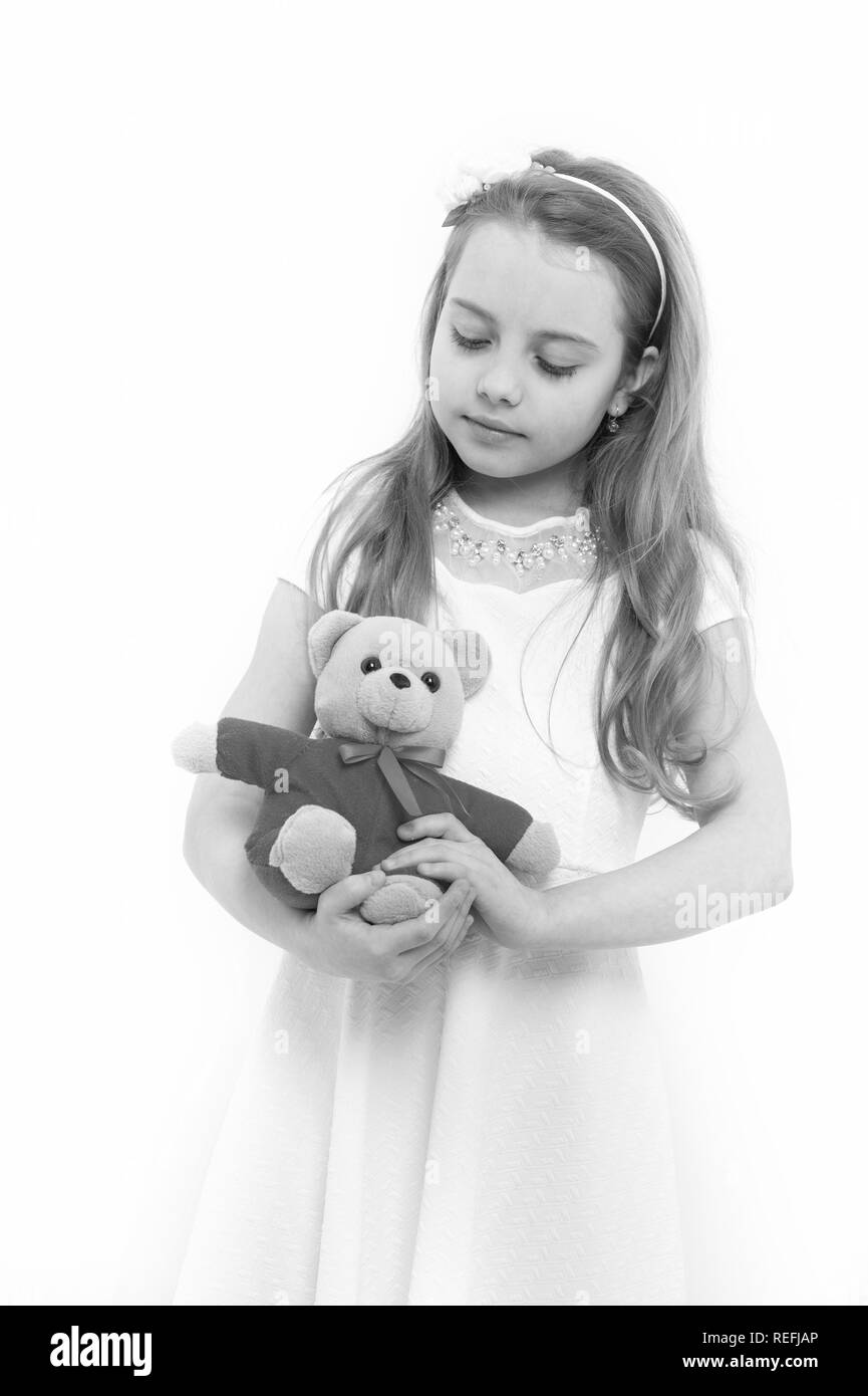 Birthday, anniversary celebration. Child with teddy bear isolated on white. Girl play with soft toy. Happy childhood concept. Holiday present and gift Stock Photo