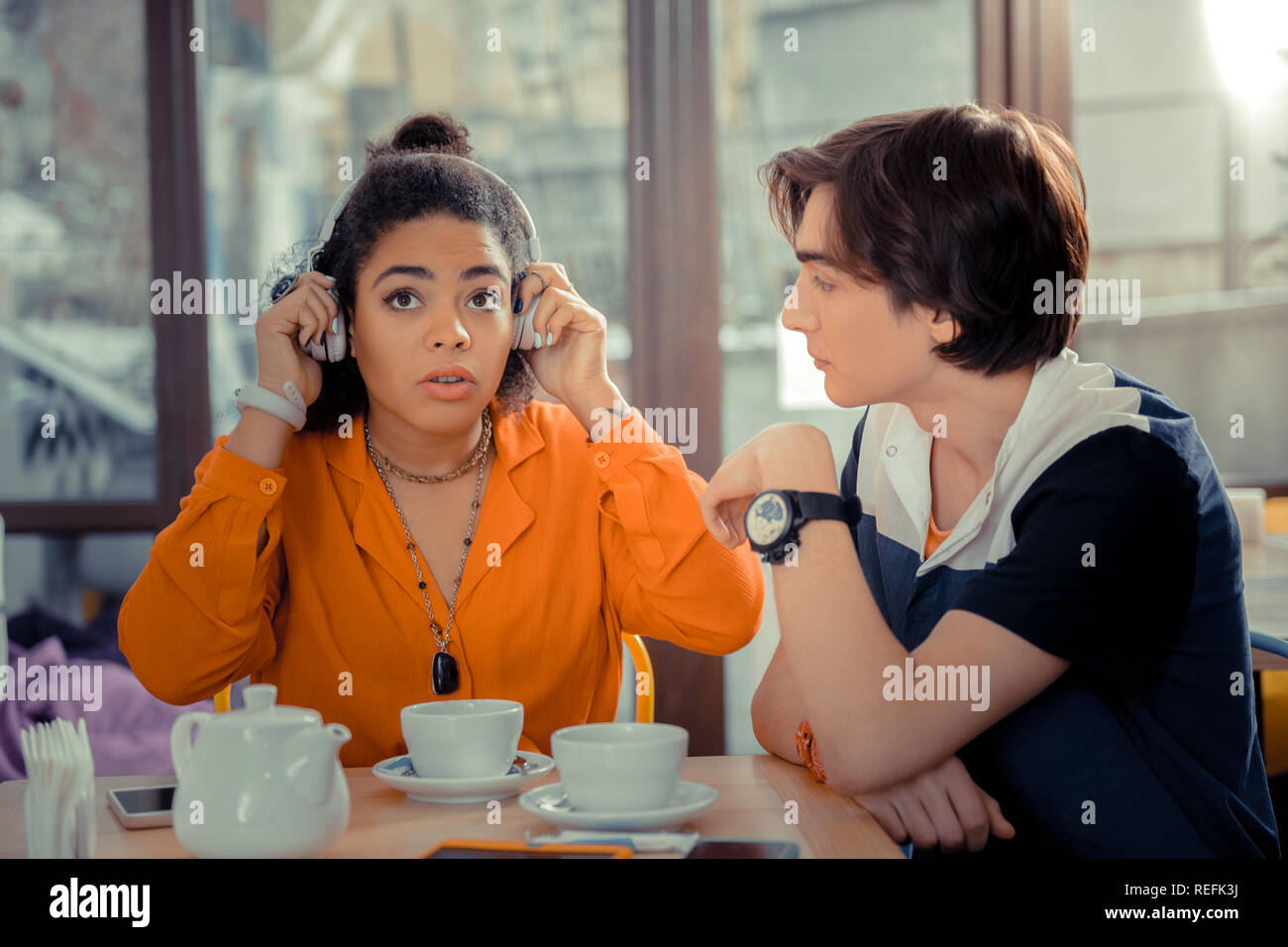 Girl is impressed by listening to the new music band Stock Photo Alamy