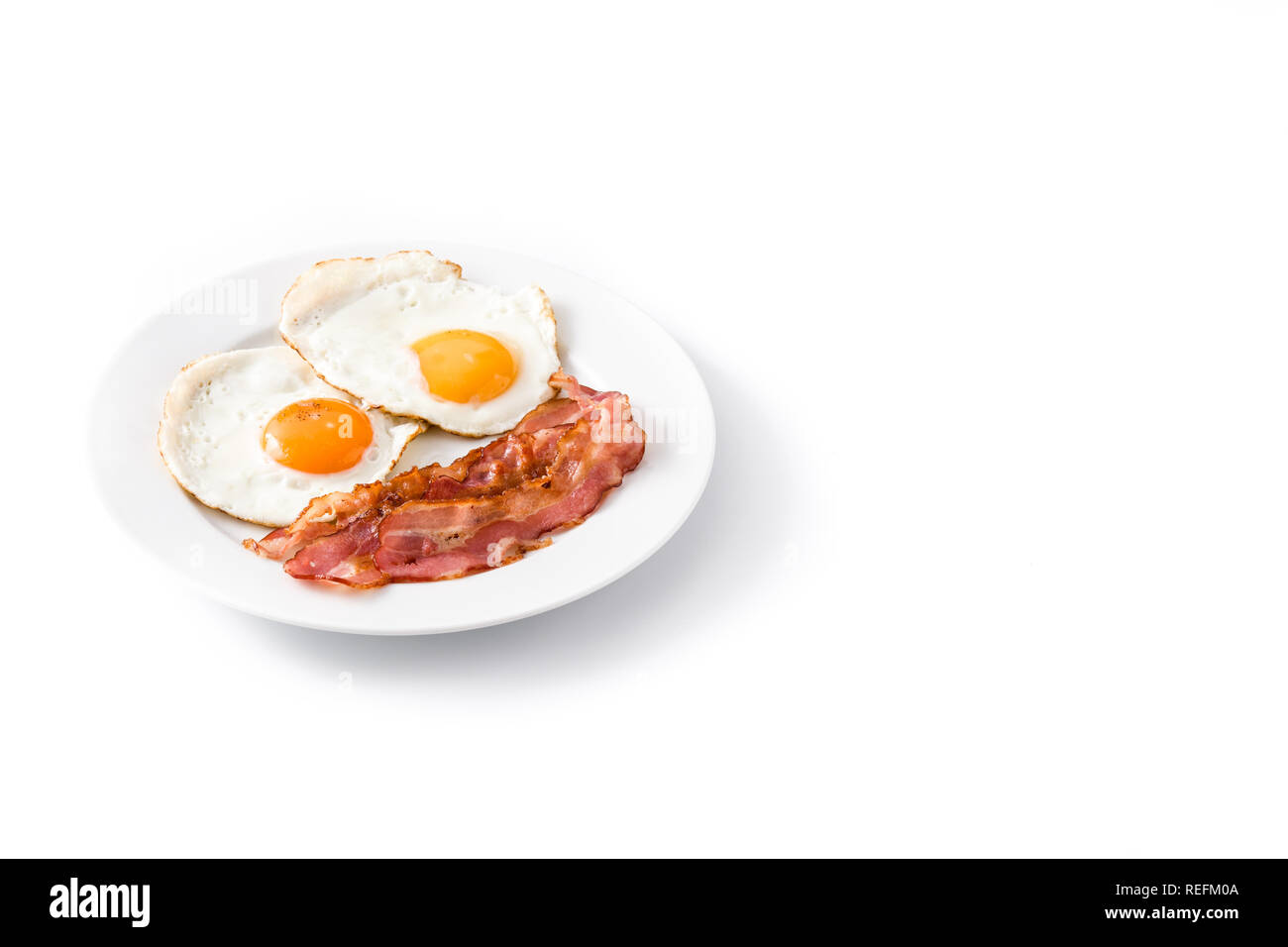 Fried eggs and bacon for breakfast isolated on white background ...