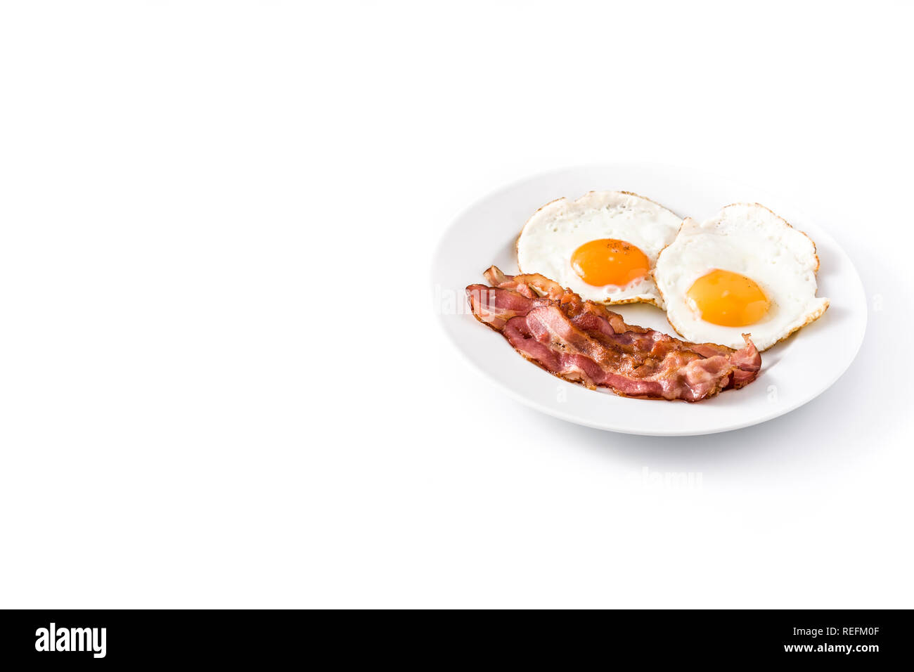 Fried eggs and bacon for breakfast isolated on white background ...