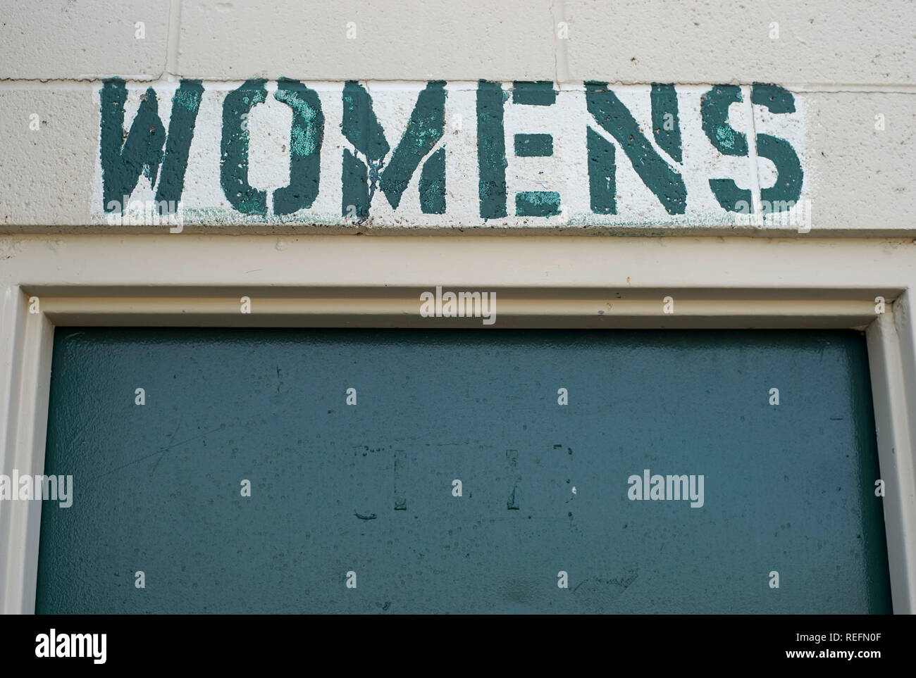 Public restrooms in Alpine, Texas, misspelling the plural of the word woman Stock Photo