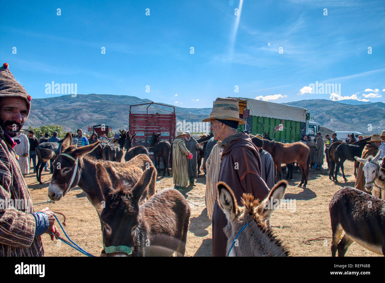Oued Laou, Chefchaouen, Morocco - November 3, 2018: Vendors and buyers of donkeys gathered in the street market that is installed every Saturday Stock Photo