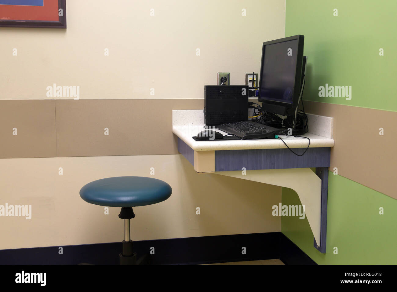 Doctor's computer station in medical patient exam room Stock Photo