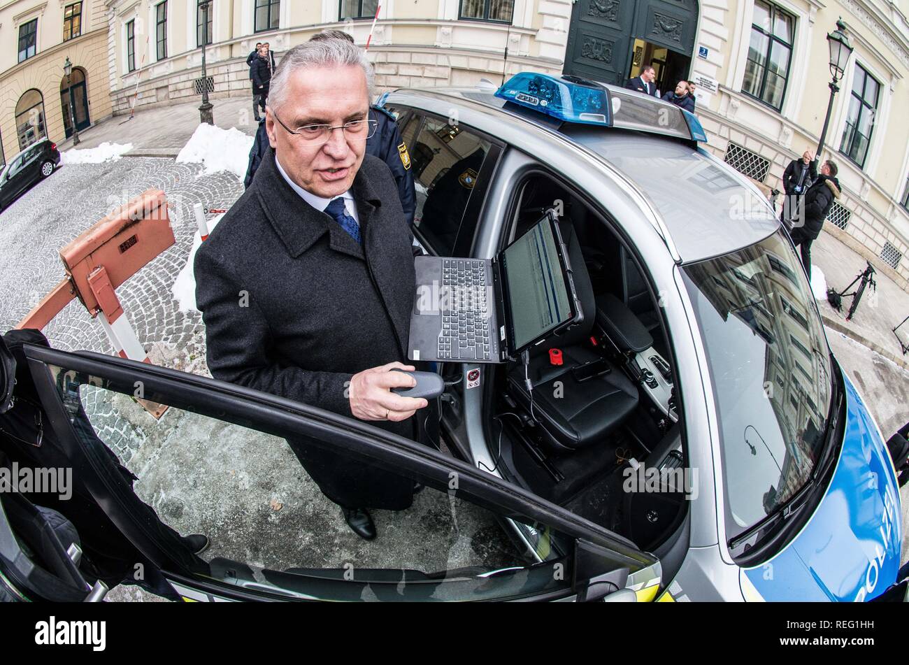 Munich, Bavaria, Germany. 21st Jan, 2019. Bavarian Interior Minister JOACHIM HERRMANN and Hubert Weiss of the Passau Border Police with the vehicles of the Bavarian Border Police in a display of their equipment and their capabilities. The Bavarian Innenminister Joachim Herrmann and the Direktor der Bayerischen Grenzpolizei Alois Mannichl presented the half year statistics of the controversial border police (Grenzpolizei) that operates at the border crossings between Germany and Austria. Herrmann announced plans to double the border protection police by 2023 and also outfit the personnel w Cred Stock Photo