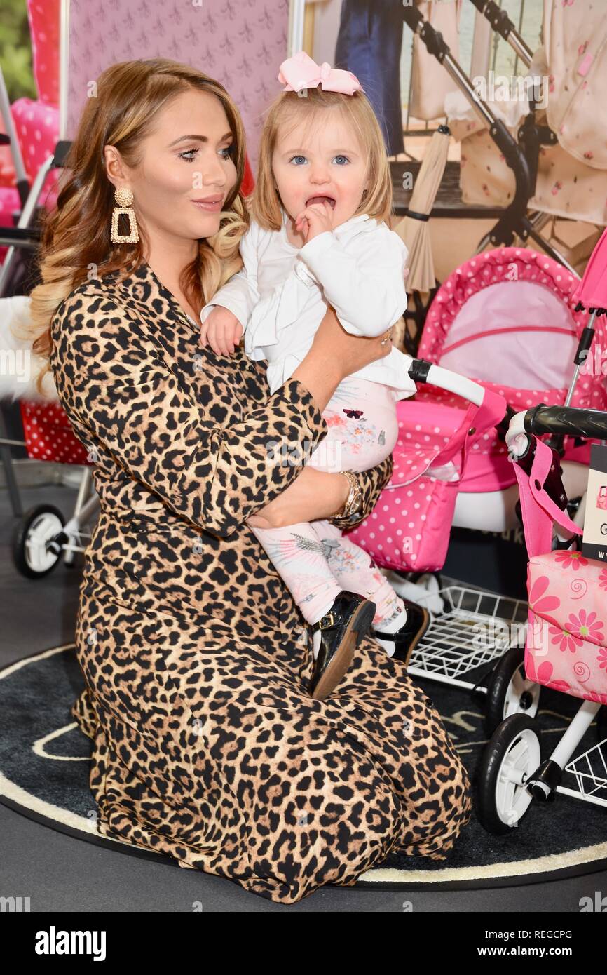 London, UK. 22nd January, 2019. Amy Childs and daughter Polly,Roma Pram Stand,The Toy Fair,Olympia,London.UK Credit: michael melia/Alamy Live News Stock Photo