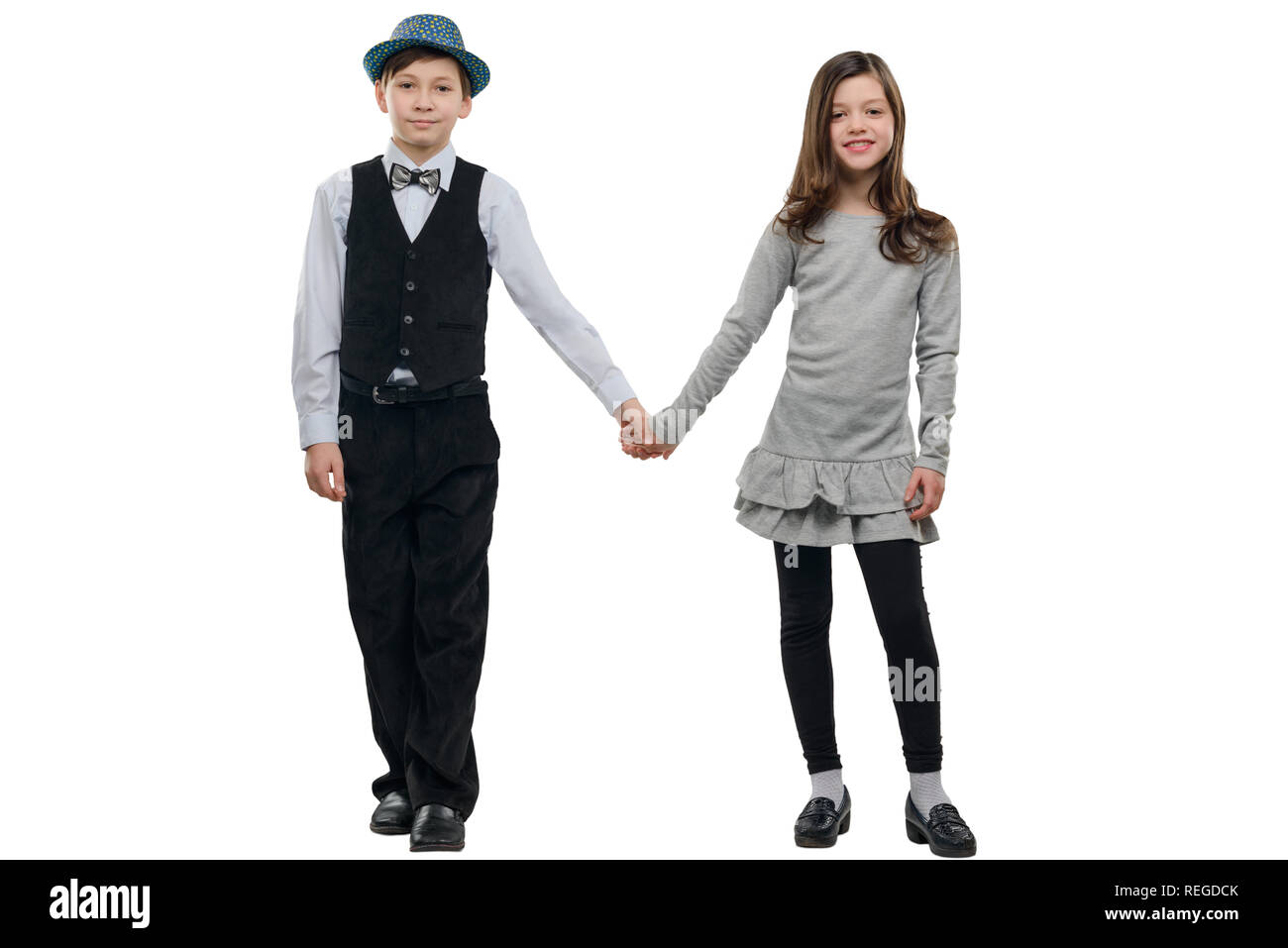 Boy and girl holding hands Stock Photo - Alamy