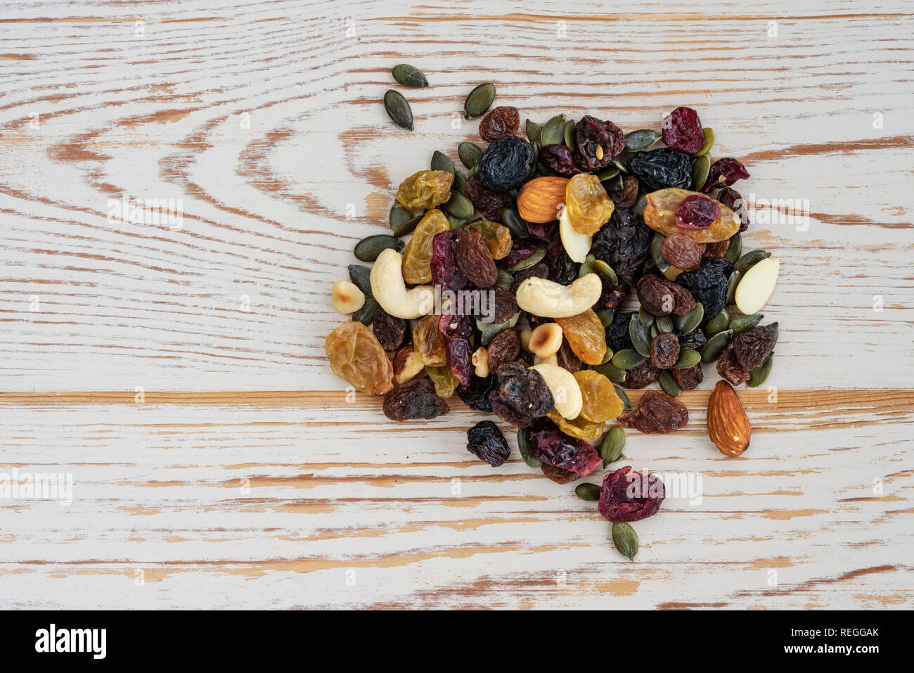 Mixture of dried fruits, nuts and seeds. Trail mix nutrition. Stock Photo