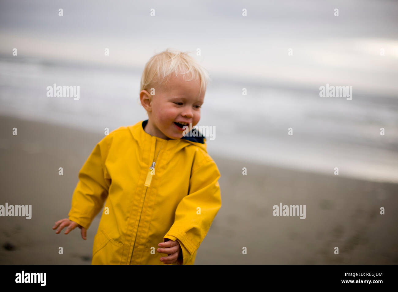 Toddler Boy In Yellow Raincoat Stock Photos & Toddler Boy In Yellow