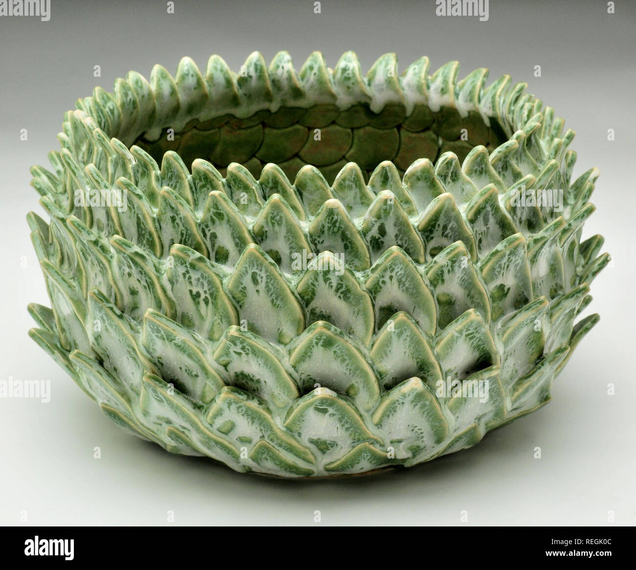 Petal formed green ceramic glazed bowl Stock Photo
