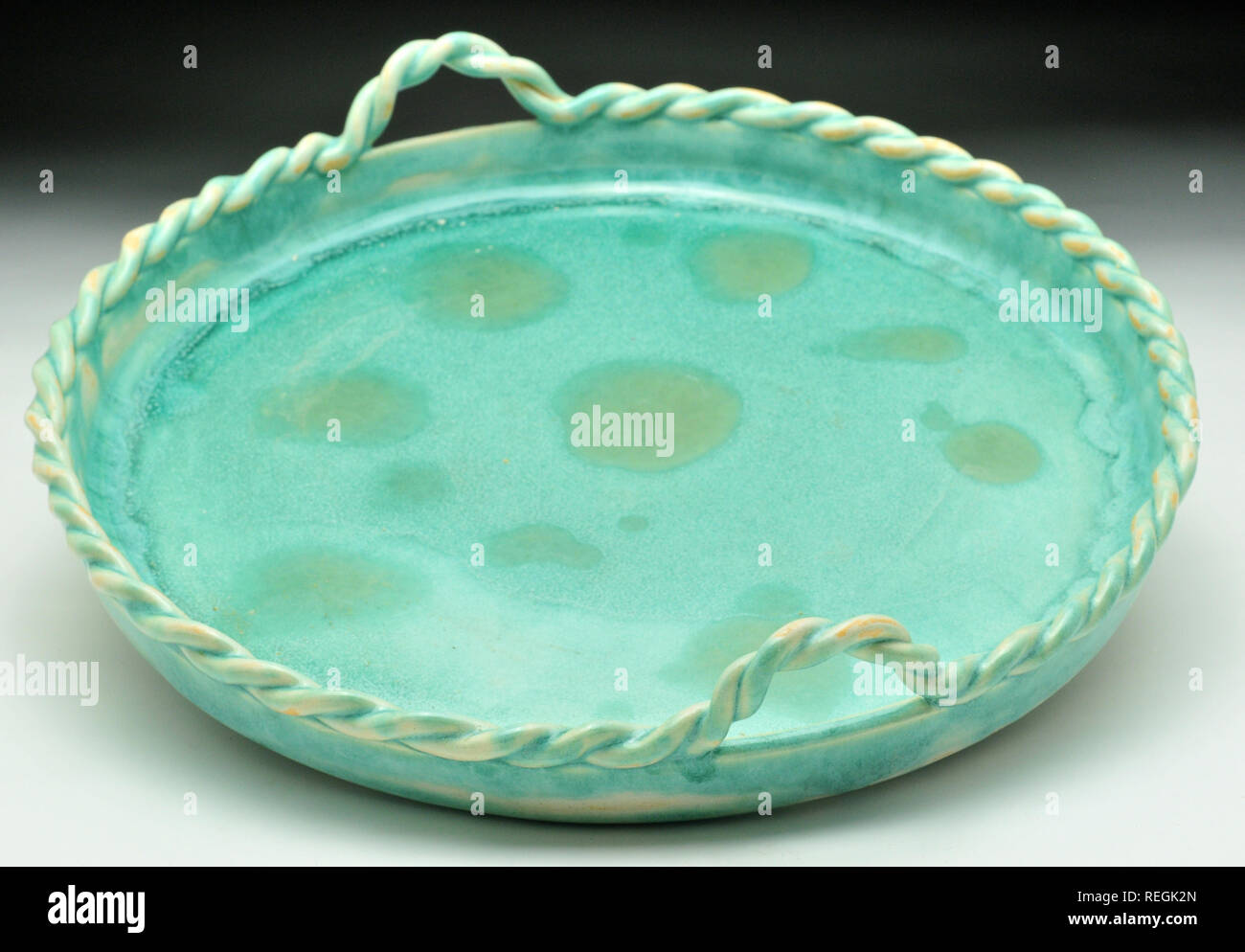 Jade ceramic glazed dish with rope handles Stock Photo Alamy