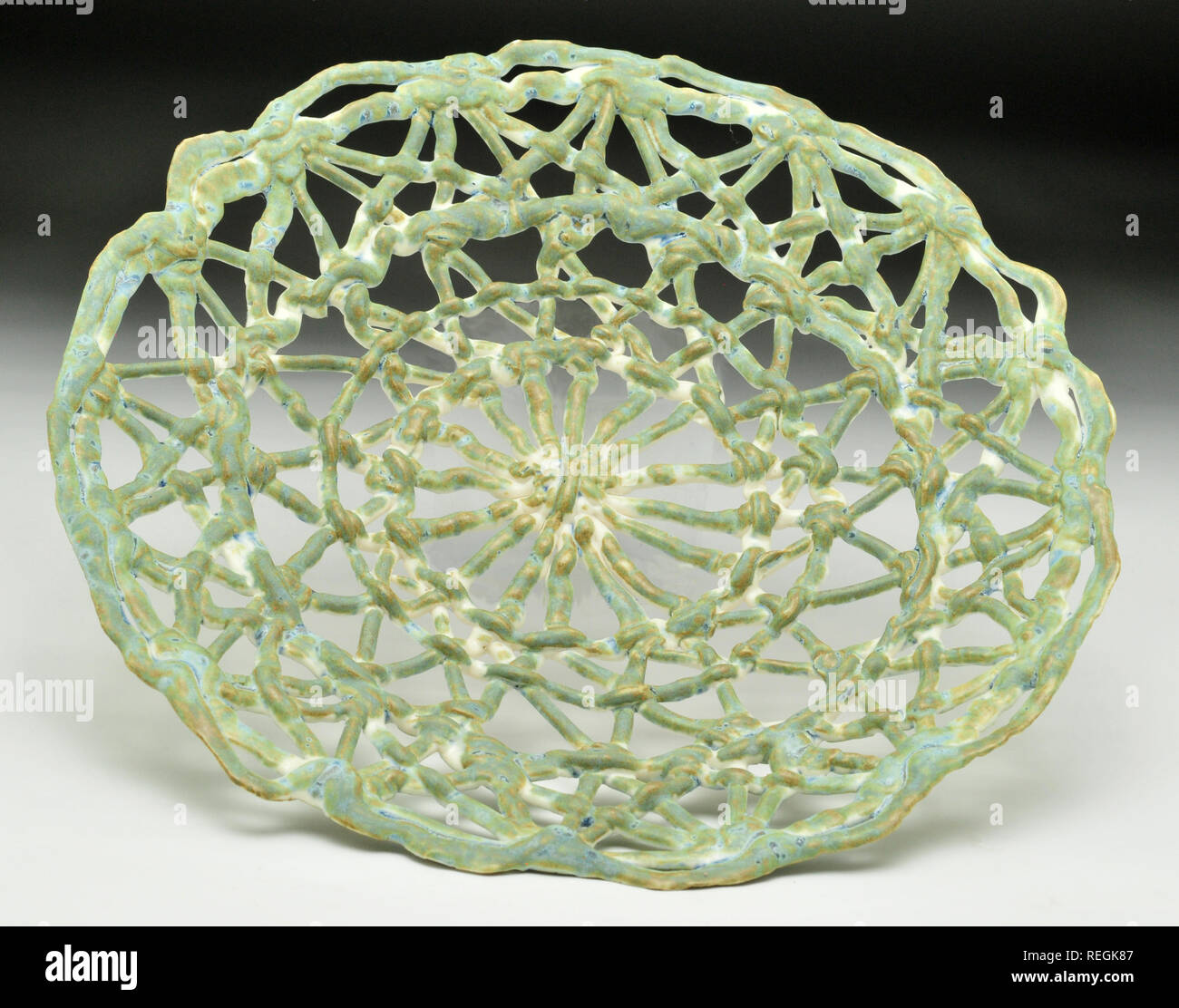 Jade ceramic glazed lattice plate Stock Photo